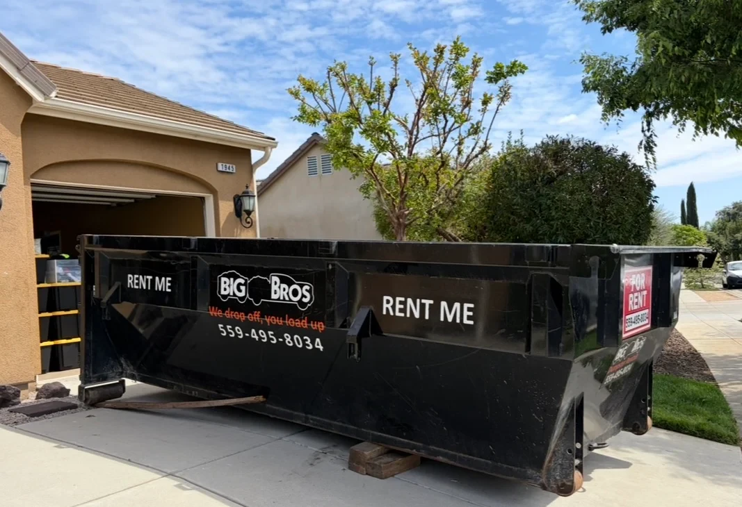 Big Bros Dumpster Rentals roll-off truck in Fresno, CA